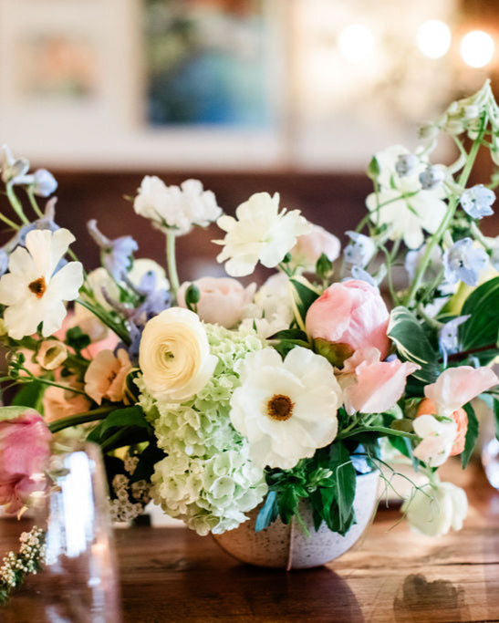 Floral arrangement on a table with a blurred background