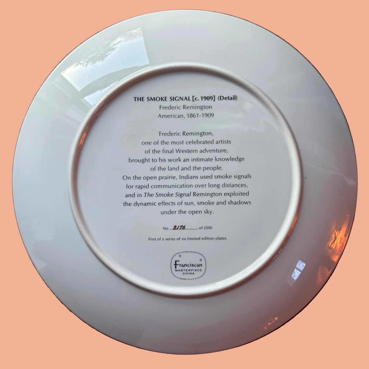 White plate with text on a wooden surface